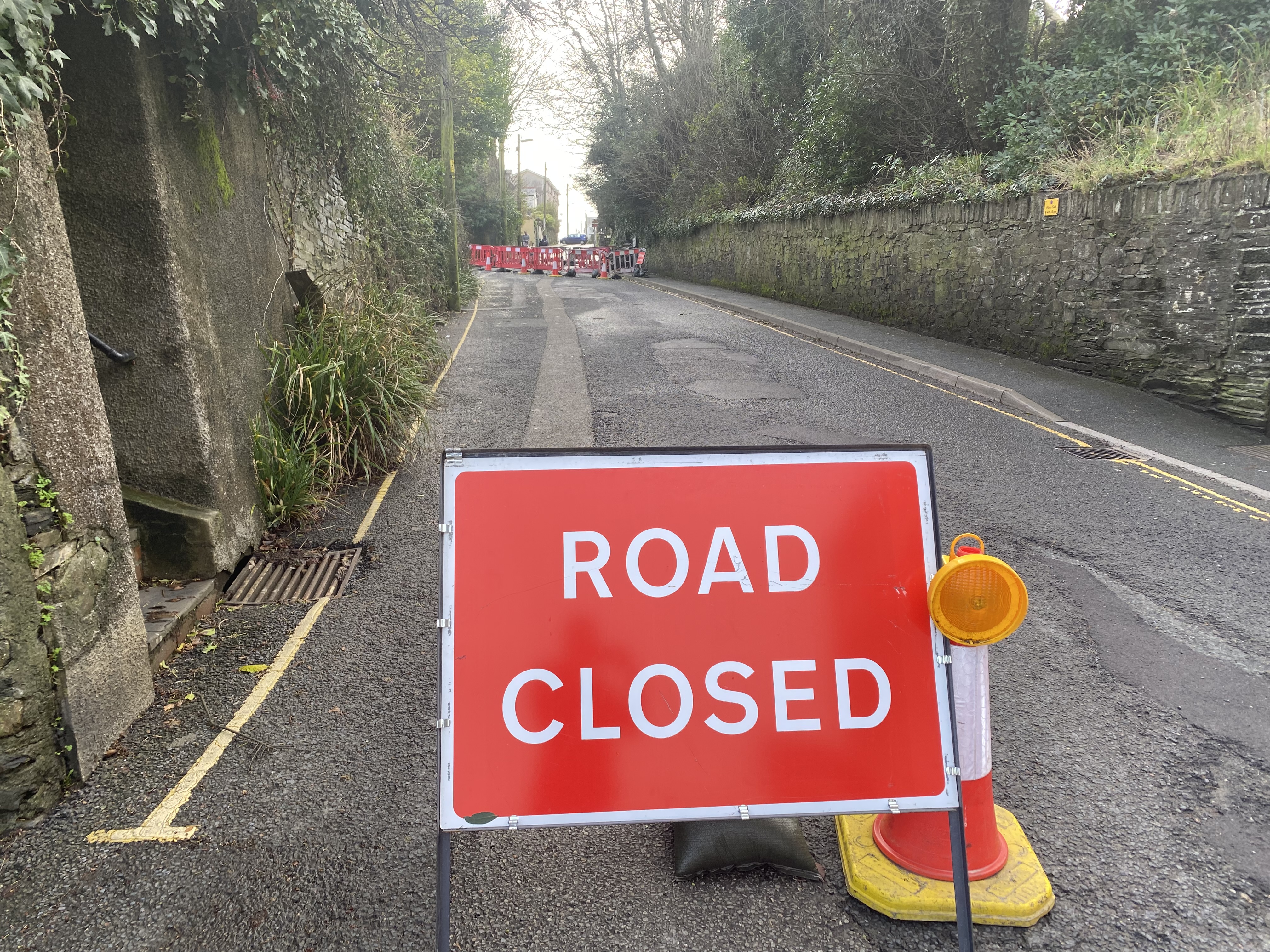 Road into town centre closed after wall collapse bude today